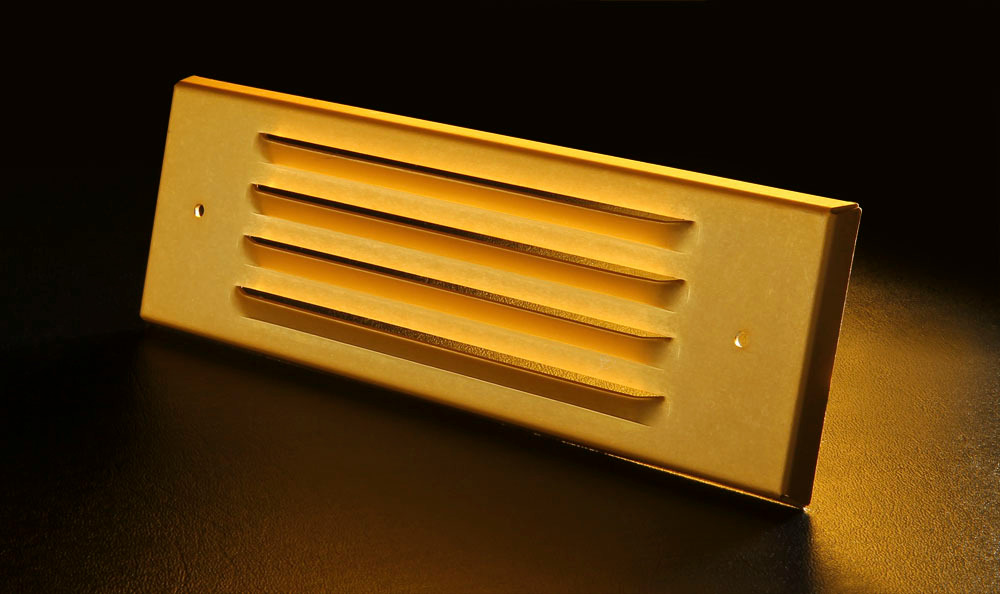 An image of a small copper stamped part from Pacific Metal Stampings
